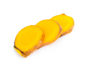 Closeup turmeric roots slices on white background