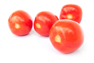 Closeup fresh red tomatoes on white background, food and vegetab