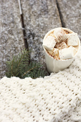 Obraz na płótnie Canvas A cup of warm cocoa with marshmallows