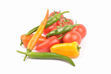 Fresh colored pepper and tomato on a white background