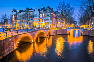 View of Canal House at night in Amsterdam, Netherlands
