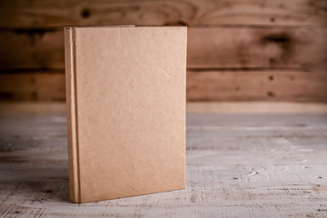 blank sketchbook on wooden floor