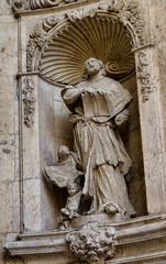 Stone sculpture on the facade of Cathedral in Valencia, Spain