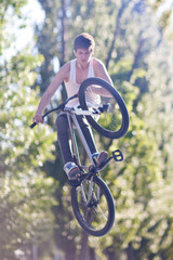 Fototapeta premium Boy on bike make the tabletop trick