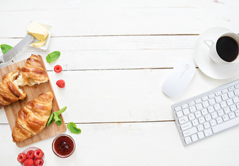 breakfast time with croissants and coffee at workplace - Powered by Adobe