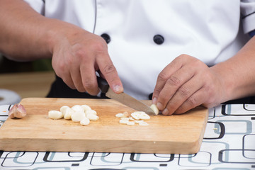 Chef is cutting garlic 