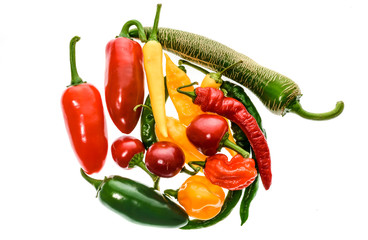 Different variety of hot peppers or chilies, isolated on white.