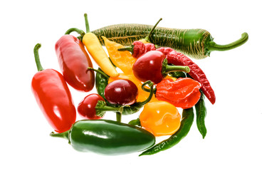 Different variety of hot peppers or chilies, isolated on white.