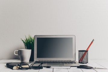 Fototapeta premium Laptop and other electronics on workspace