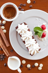 brownie with cream cheese on a dark wood background