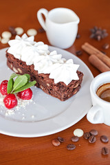 brownie with cream cheese on a dark wood background
