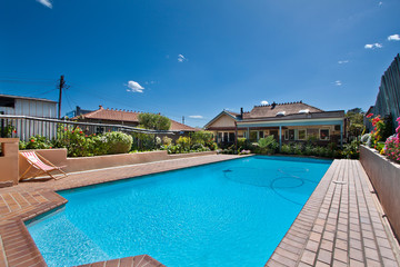 Fototapeta na wymiar beautiful house with swimming pool in the yard