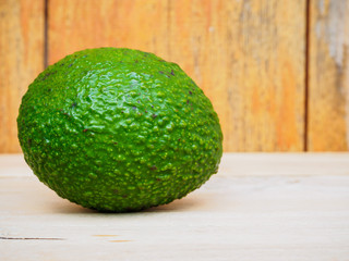 fresh organic avocado on wood table