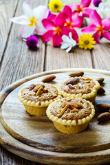 Homemade Almonds tart on wooden table background