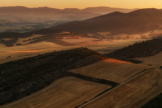 Warm sunrise over cereal fields