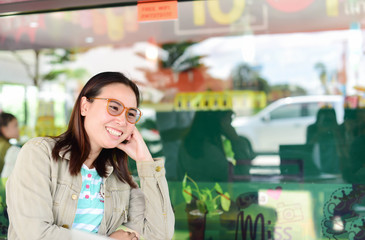 Woman worker of happy with cup of coffee