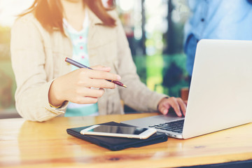 Woman worker of happy with  notebook and phone