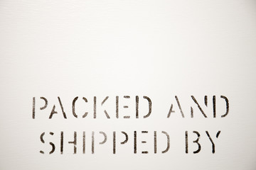 Packed and Shipped by lettering on box