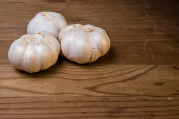 Garlic cloves on a wooden background