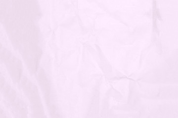 Crumpled light pink paper texture or paper background for design with copy space for text or image.