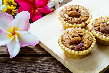 Homemade Almonds tart on wooden table background