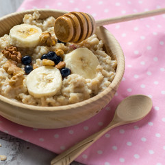Oatmeal in a wooden bowl
