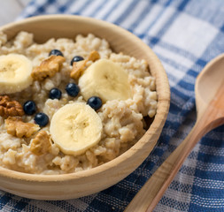 Oatmeal porridge with bananas, blueberries