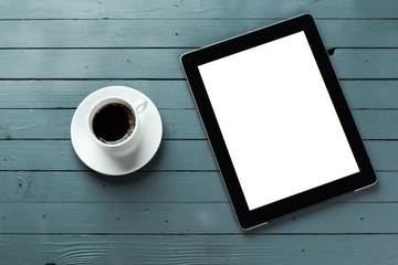 digital tablet and coffee cup on wooden table - Powered by Adobe