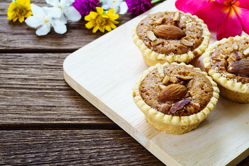 Homemade Almonds tart on wooden table background