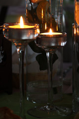 Two candles are lit, romantic evening