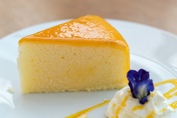 Orange cake on white plate. (Selected focus)