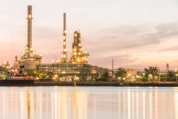 Oil refinery plant at dusk.