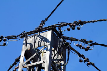 Old electricity pole with wires.