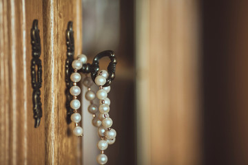 white pearls necklace  in the key