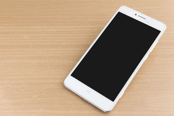 blank screen white smartphone on desk