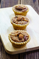 Homemade Almonds tart on wooden table background