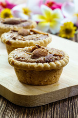 Homemade Almonds tart on wooden table background