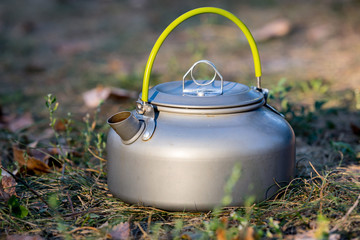 tourist kettle in grass
