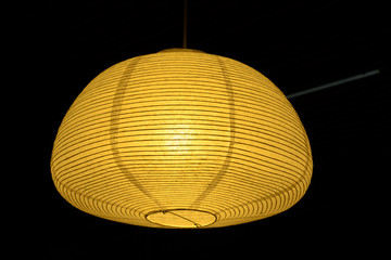 Yellow paper lamp japan style on black backround