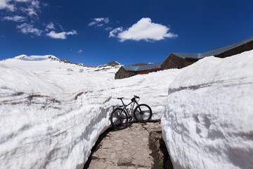 Journey on a bicycle in the mountains in the snow © Oleg Breslavtsev
