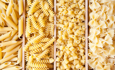 Various types of dry pasta of different shapes