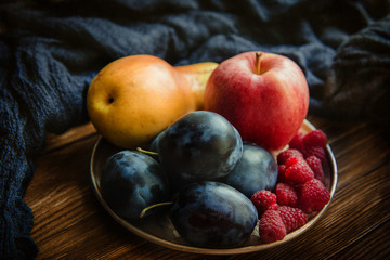 Assortment of fresh fruits and berries. Fruits plum, apple, pear.