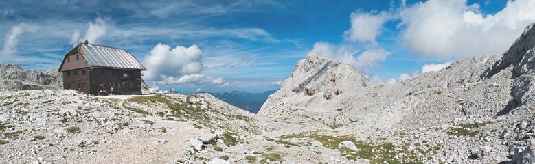 panorama of Dom Valentina Stanica mountain hut with Rjavina mountain in Julian Alps in Slovenia - obrazy, fototapety, plakaty