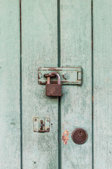 old wood door locked, secure and close concept.