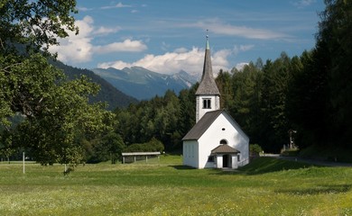 Fototapeta na wymiar village church in Mojstrana in valley of Sava river in Slovenia