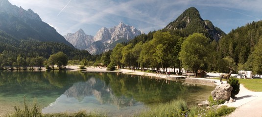 panorama of artifiical lake with Razor and Prisojnik mountains north of Krajnska Gora in Slovenia