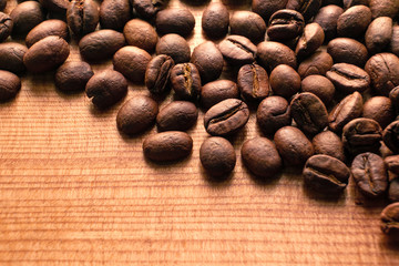 Close up roasted coffee beans on wood background
