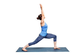 Sporty fit woman practices yoga asana utthita Virabhadras