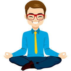 Young businessman on yoga pose relaxing happy