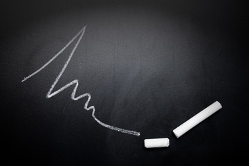 wavy-line-and-broken-chalk-stick-on-blackboard-focus-on-chalk-fa